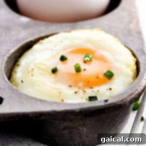 A perfectly fried egg cooked in a cast iron pan, ready to serve.