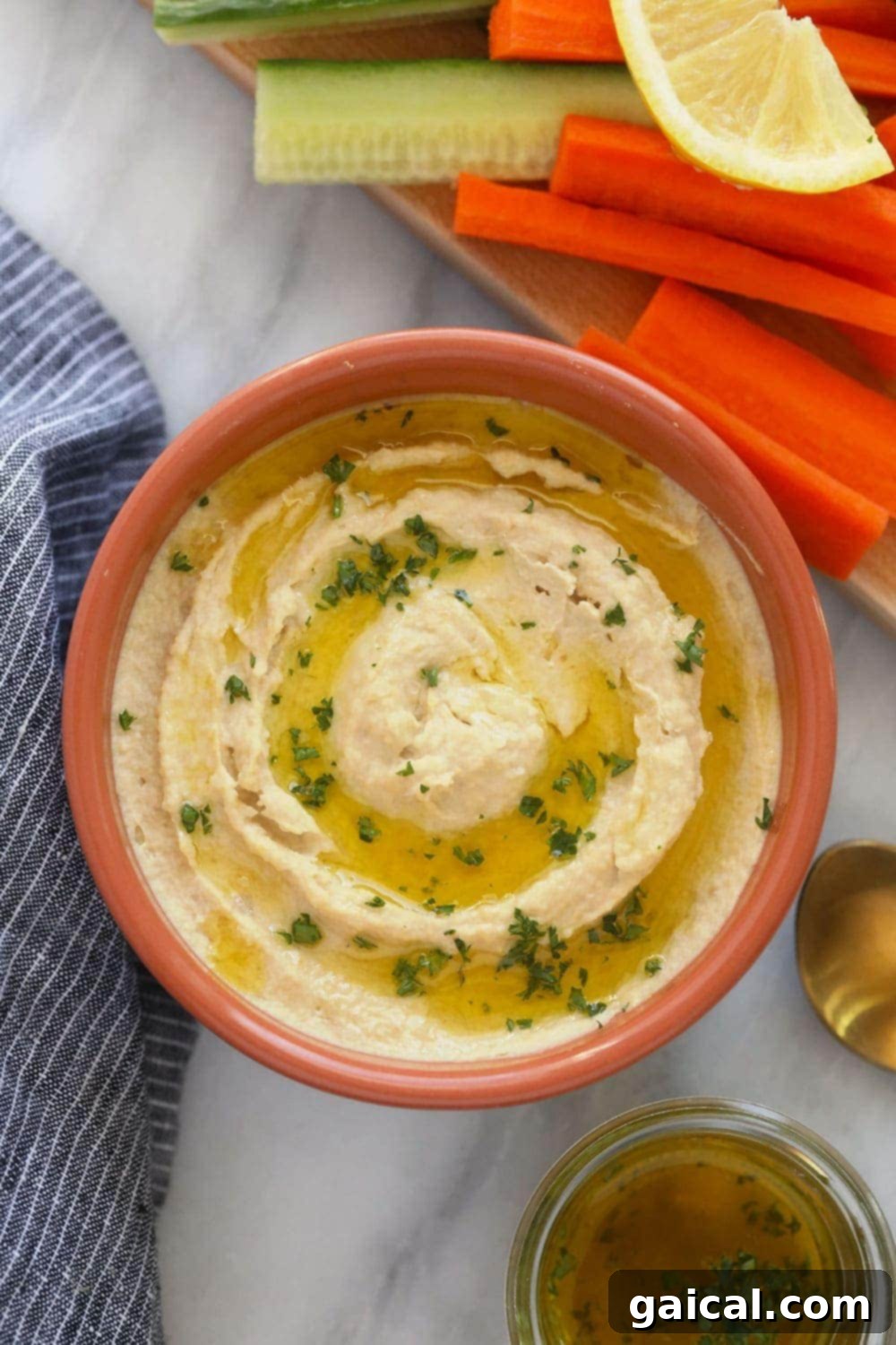 Creamy Homemade Hummus Made Easy 2 A bowl of freshly made lemon garlic hummus, garnished and ready for dipping.