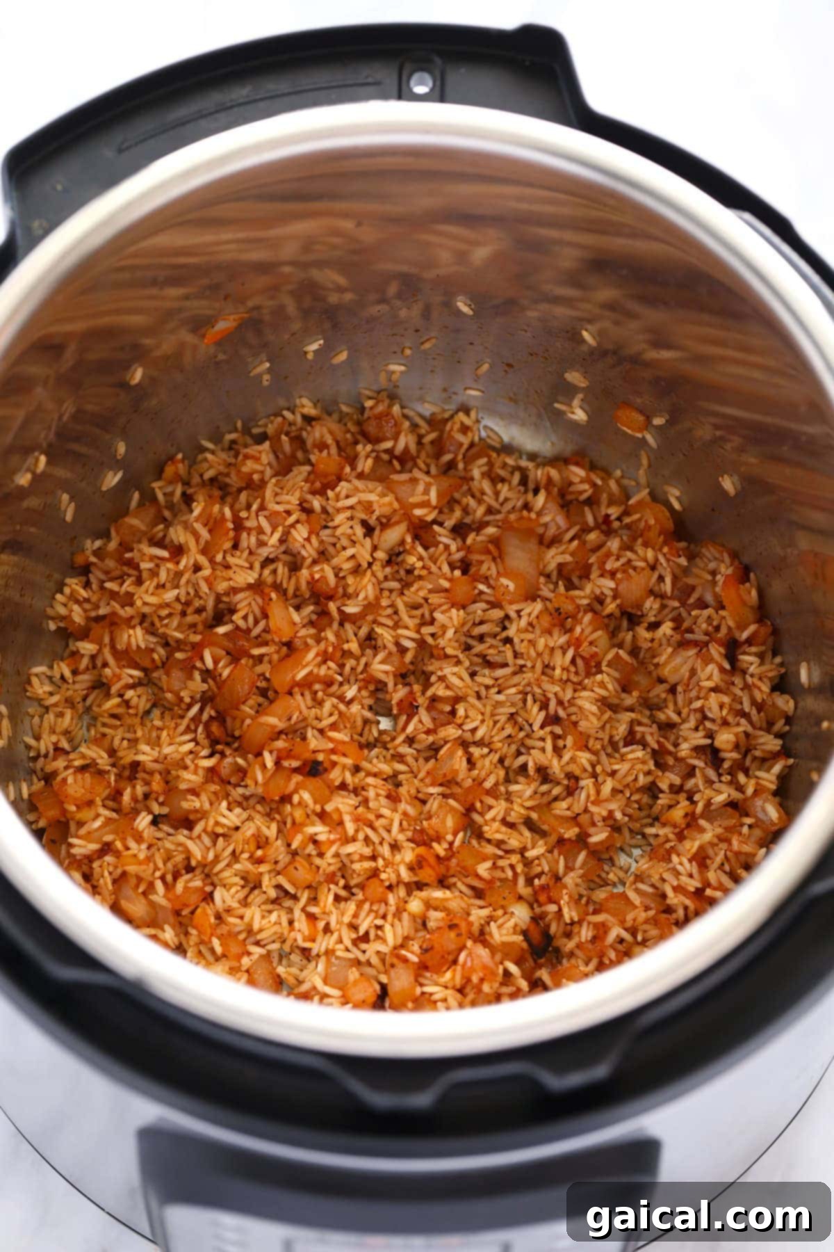 Easy Instant Pot Jambalaya 4 All the prepped ingredients for Jambalaya, including diced vegetables, rice, canned tomatoes, and broth, layered neatly inside an Instant Pot, before the pressure cooking phase.