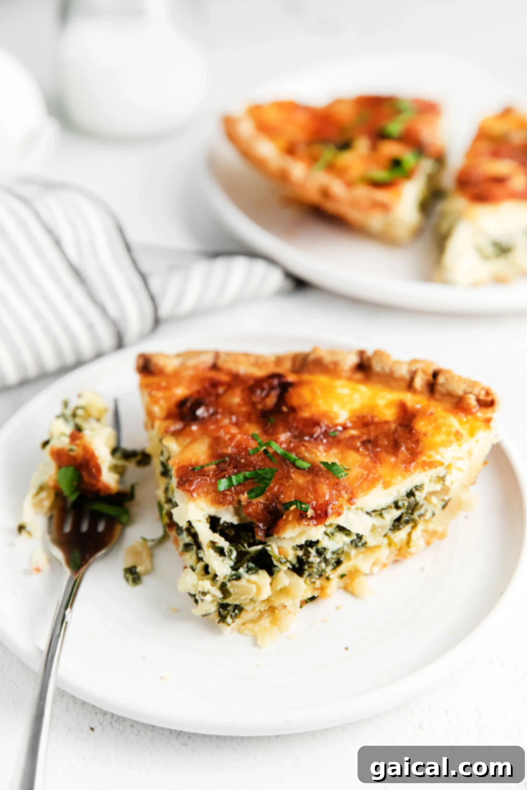 Simple & Savory Spinach Quiche 9 A vibrant and healthy spinach quiche, served on a plate and ready for a meal. The image emphasizes its appeal as a nutritious and convenient option for any time of the day.
