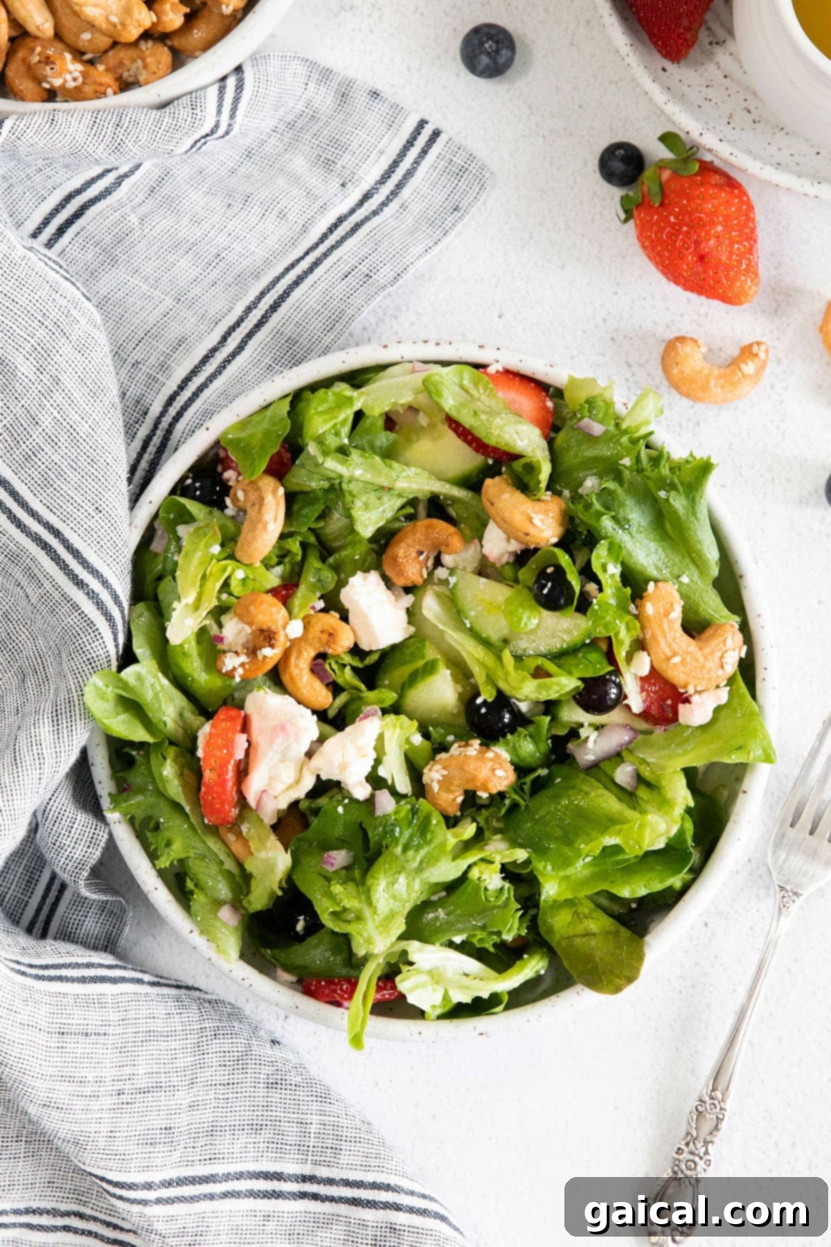 Vibrant Spring Greens 6 A beautifully presented bowl of spring mix salad, ready to be enjoyed.