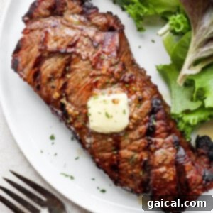 grilled steak on plate with butter