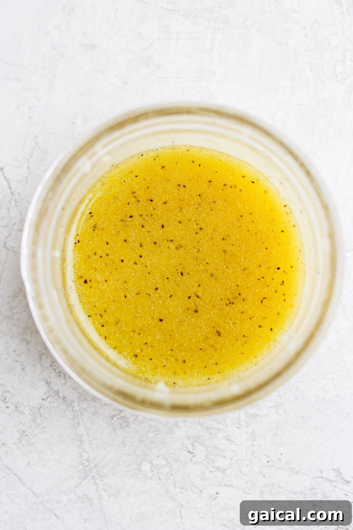 Lemon vinaigrette in a small jar. 