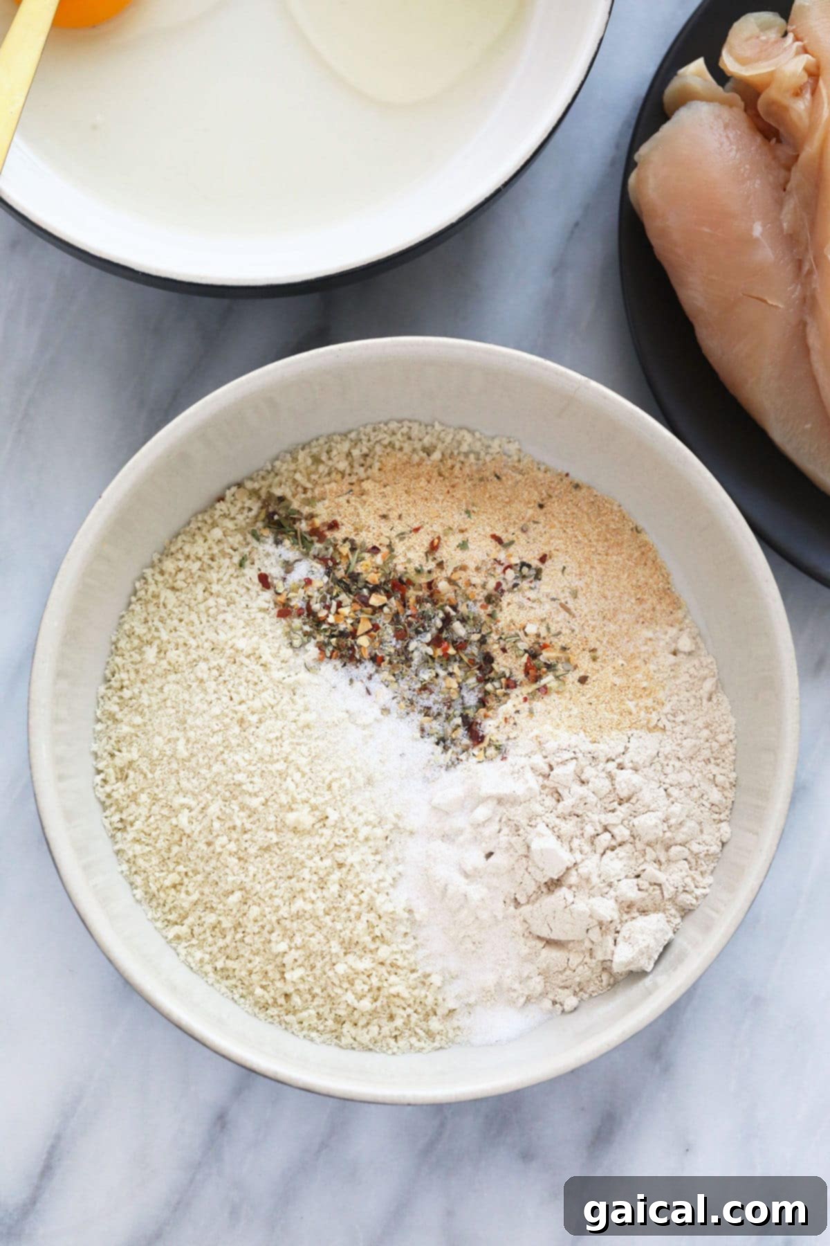 The most crispy on the outside and tender on the inside Air Fryer Chicken Tenders! These chicken tenders (air fryer style) are so easy to make, high protein, and kid-friendly. breadcrumb mixture