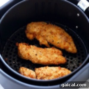 dipping chicken tender in ranch