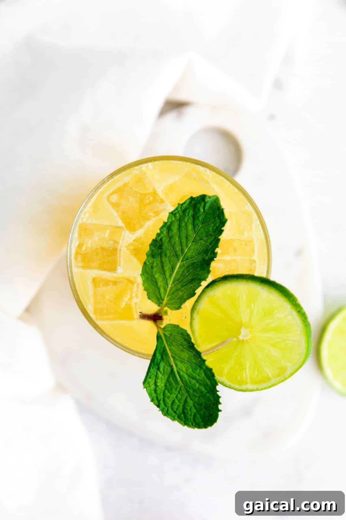 Enjoying a delightful virgin margarita on a sunny day. A perfectly prepared glass of virgin margarita with a lime wedge garnish, ready to drink.