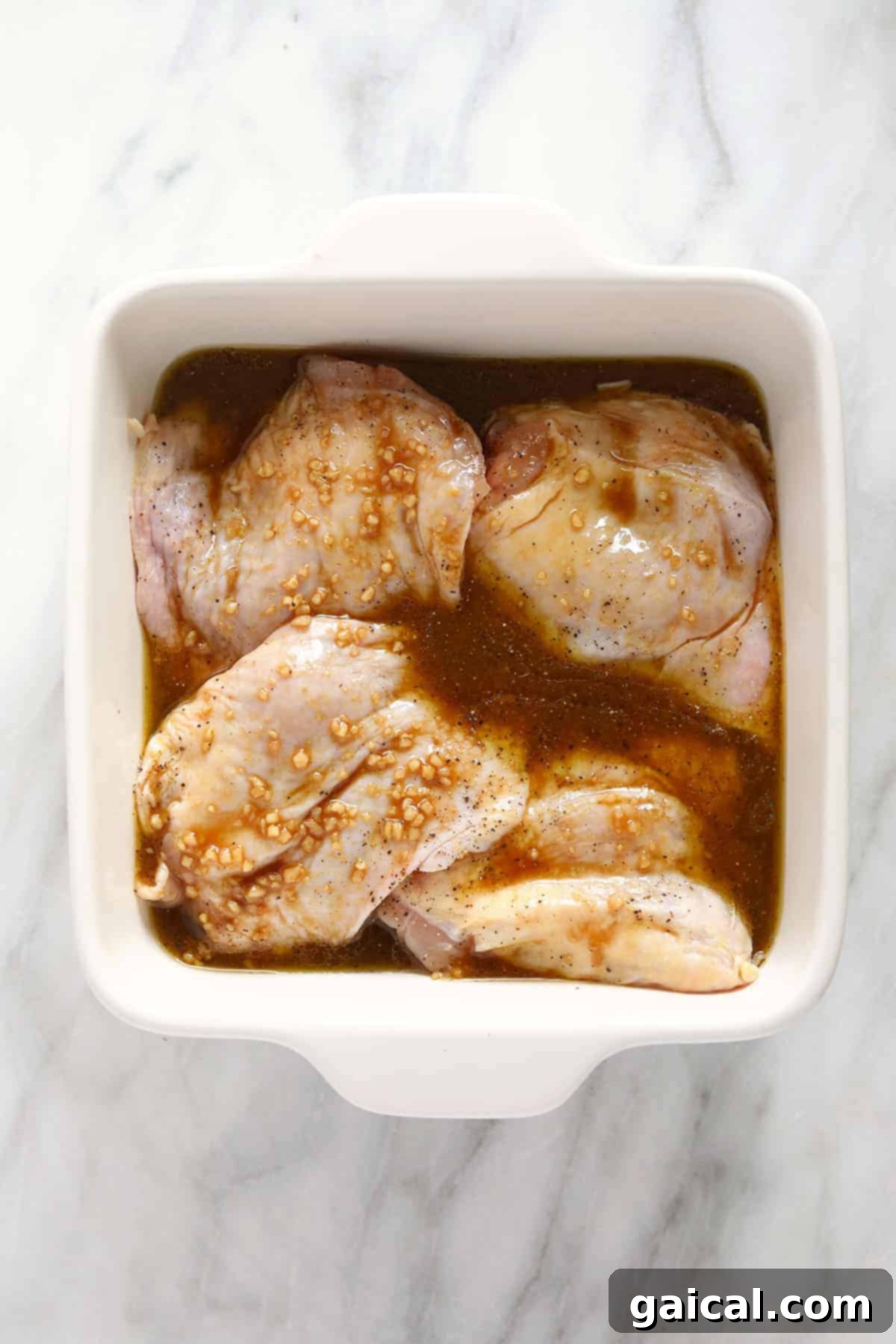 Perfectly Smoked Chicken Thighs 5 Chicken thighs marinating for a perfect chicken dinner.