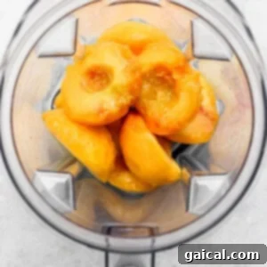 Sun-Kissed Peach Muffins 4 Peeled and sliced peaches in a blender, ready for pureeing.