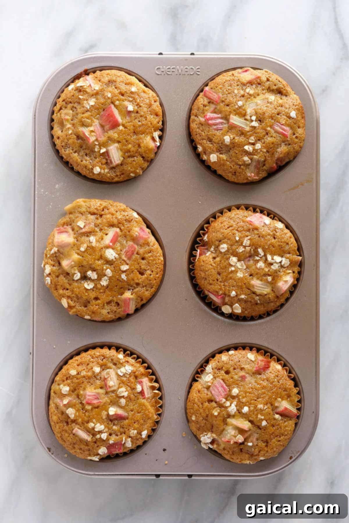 Sweet and Tangy Rhubarb Muffins 7 Rhubarb muffins in a muffin tin