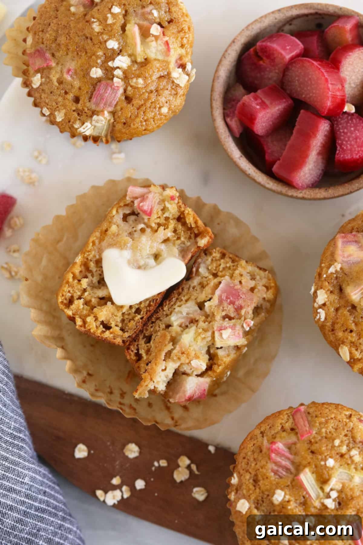 Sweet and Tangy Rhubarb Muffins 8 A rhubarb muffin with a pad of butter.