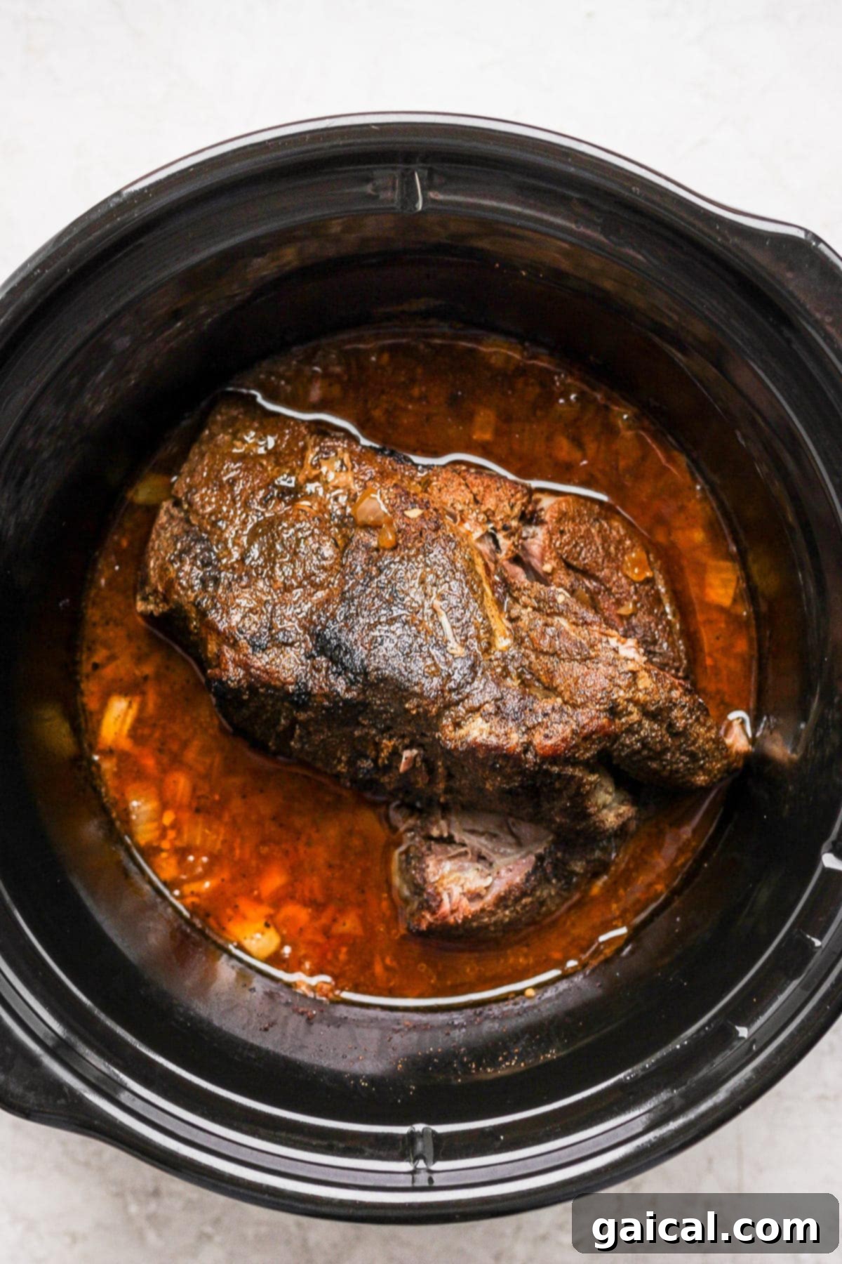 Pork shoulder cooked in a slow cooker. 