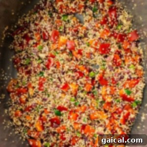 Hearty Quinoa Chili 5 Quinoa, red bell pepper, and jalapeño cooking in a Dutch oven with onions and garlic.