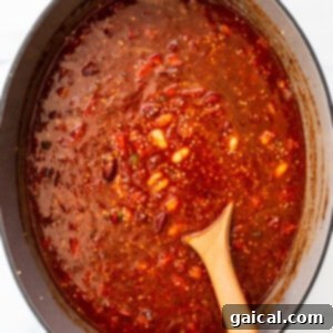 Hearty Quinoa Chili 6 All the chili ingredients, including pureed roasted red peppers, beans, and spices, mixed in a large pot.