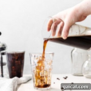 Crafting the Perfect Cold Brew 16 Pouring cold brew coffee into a glass