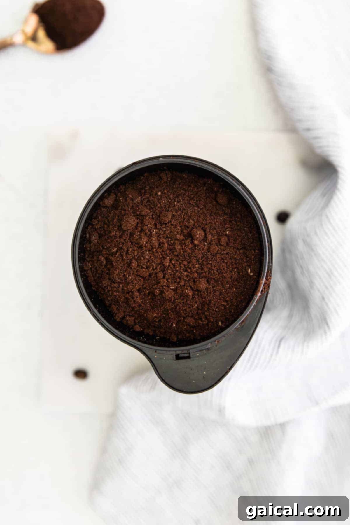 Crafting the Perfect Cold Brew 5 Coffee grounds in a coffee grinder.