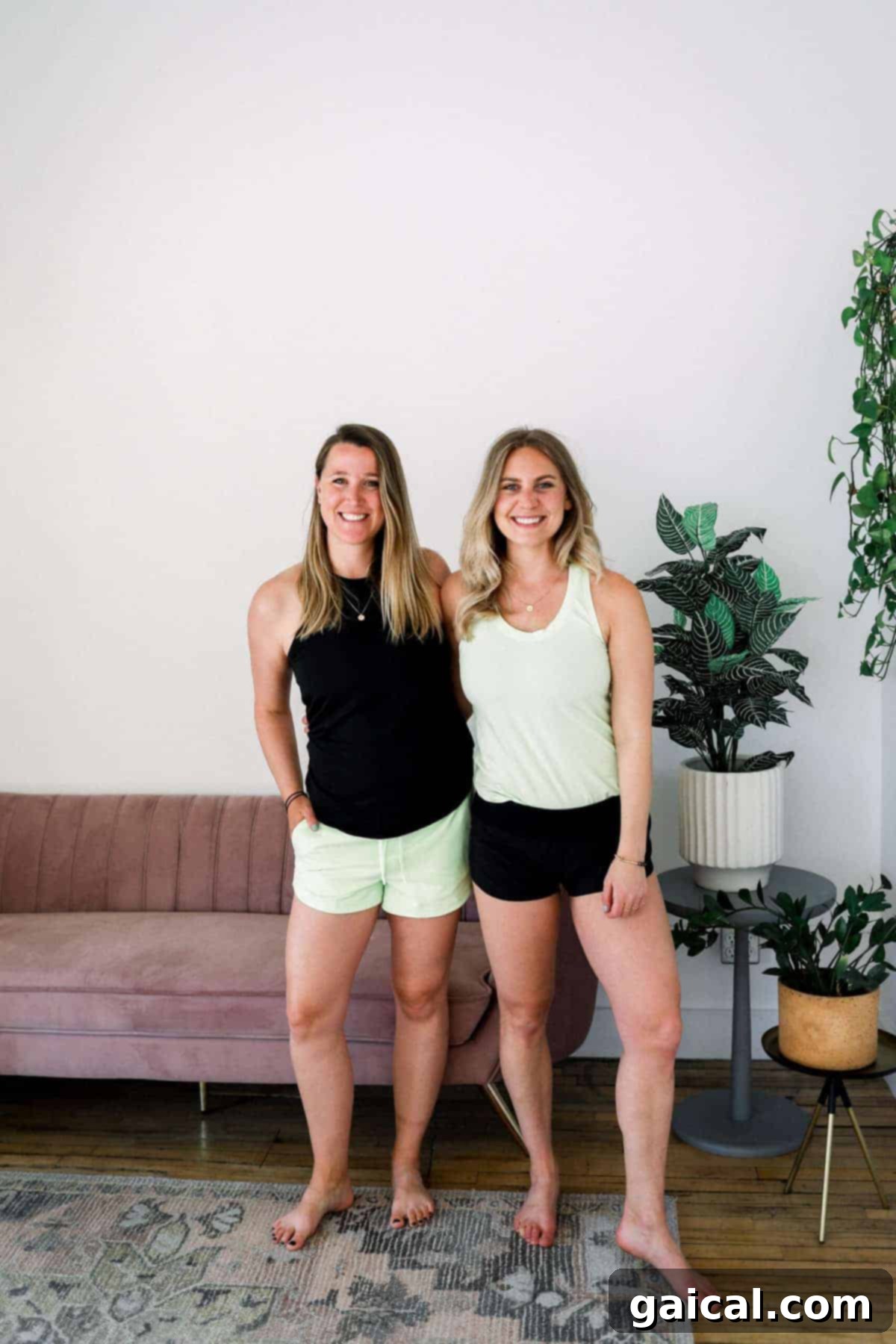 Lee and Emily from Fit Foodie Finds, smiling and showcasing their favorite Lululemon shorts for various activities.