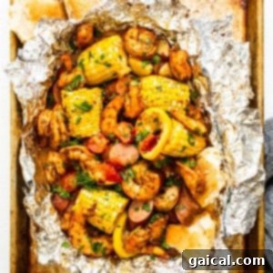 Perfectly Grilled Shrimp Every Time 3 Grilled shrimp and colorful vegetables in a foil packet, cooked to perfection, illustrating an easy meal.