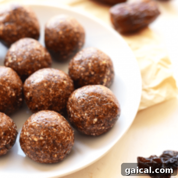 Chocolate energy balls on a white plate.