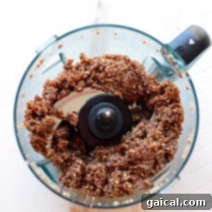 Blend chocolate granola and cherry pie energy balls together in a food processor.