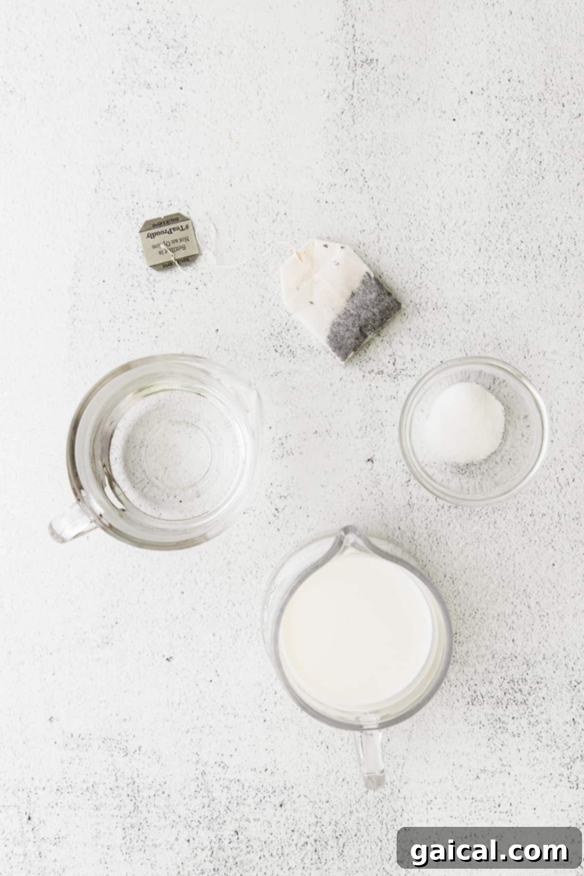 Simple Ingredients for Your Homemade Iced London Fog Latte Ingredients for Iced London Fog Latte laid out on a kitchen countertop.
