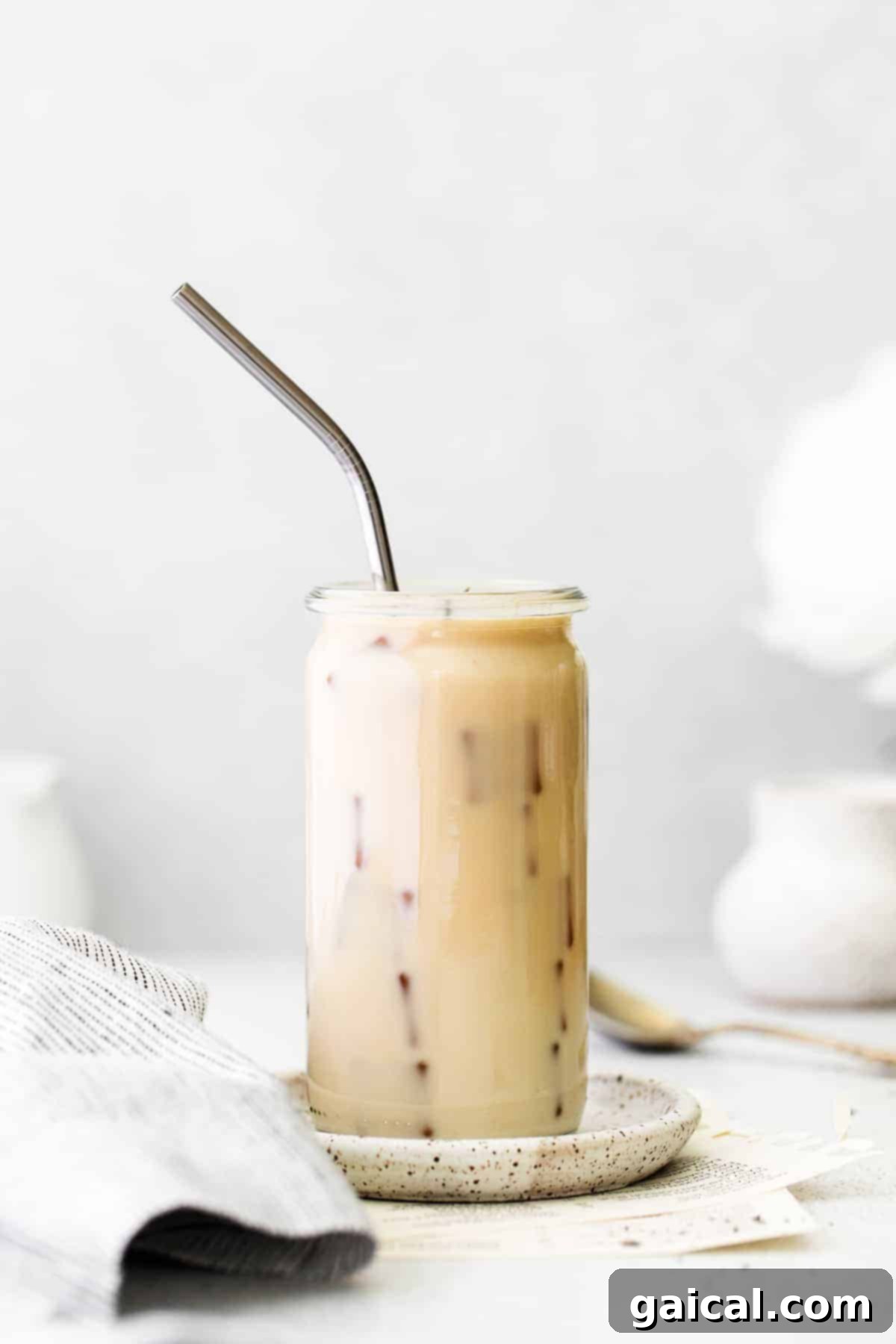 Enjoying a Chilled Iced London Fog Latte Close-up of a refreshing Iced London Fog Latte in a clear glass with ice.