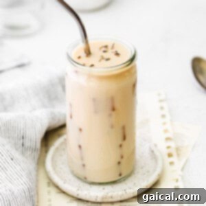 Iced London Fog Latte served over ice in a glass.