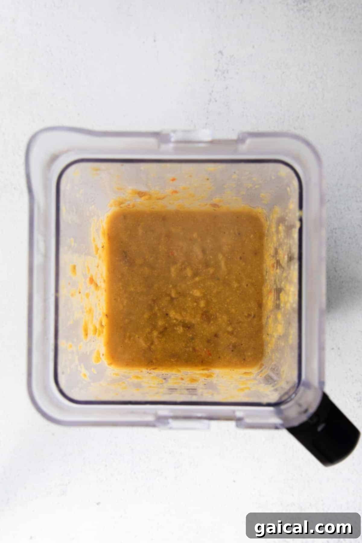 Blending for Creamy Corn Chowder A high-speed blender actively blending a portion of the corn chowder, illustrating the step to create a creamy texture.