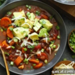 A bowl of Instant Pot Vegetarian Chili, garnished and ready to eat.