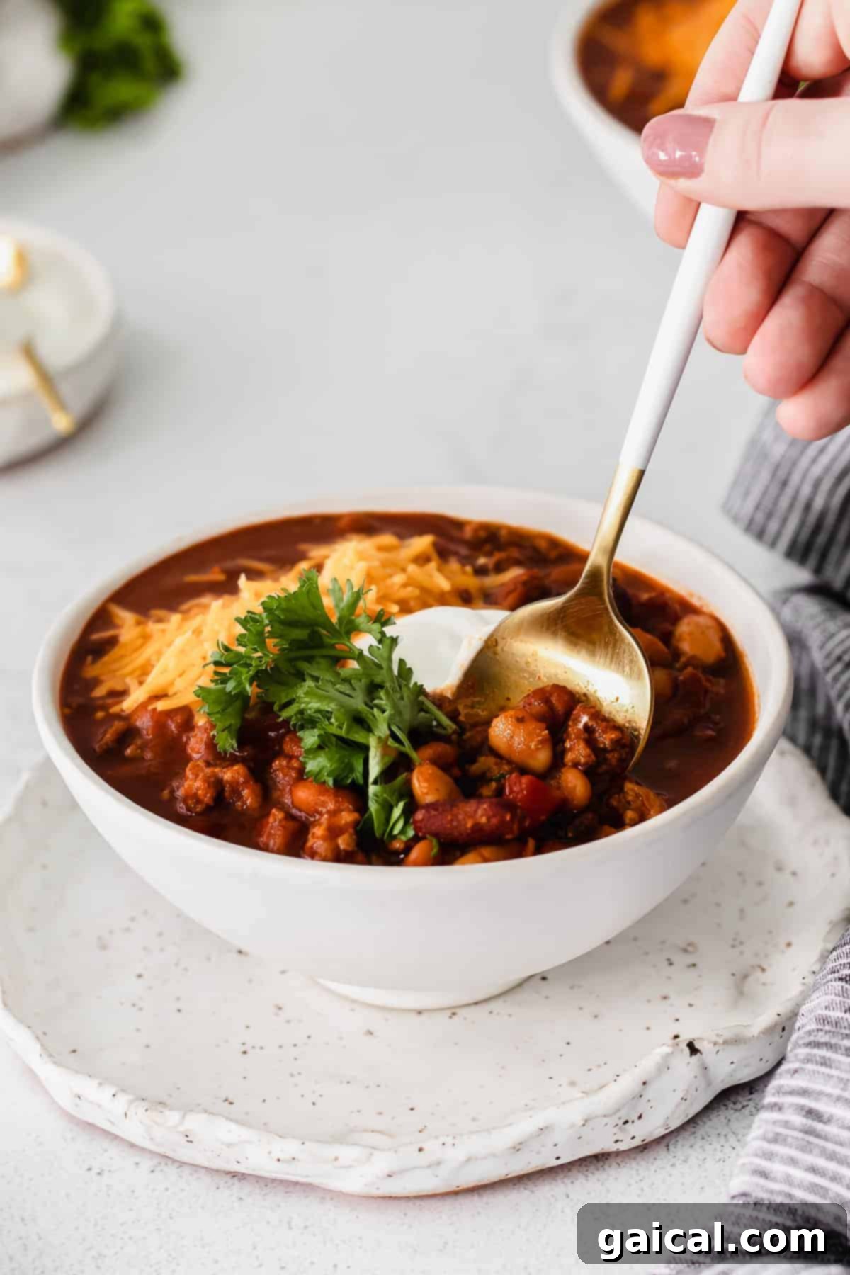 A bowl of Instant Pot chili with a spoon resting in it, ready for a comforting meal.