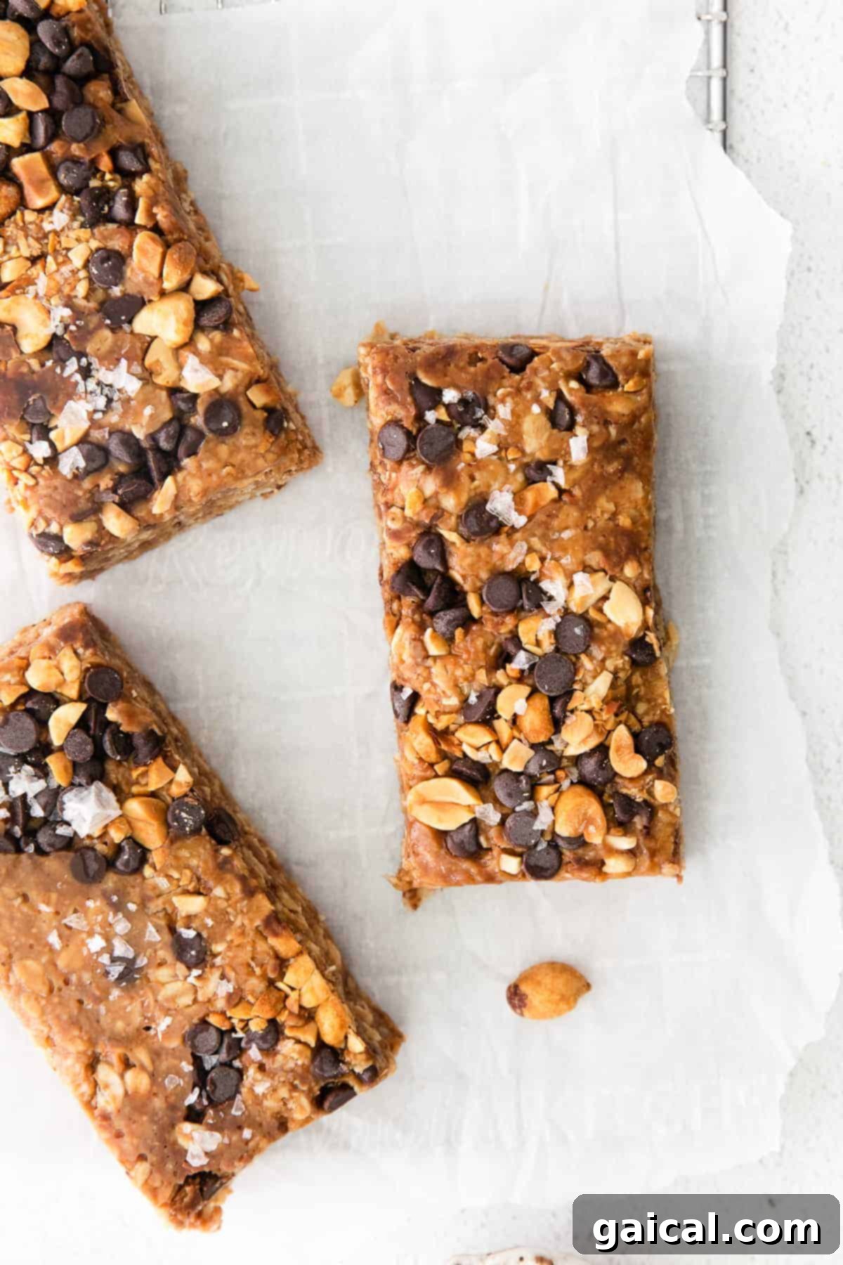 Homemade Granola Bars Displayed on Countertop Multiple homemade peanut butter chocolate chip granola bars arranged on a kitchen countertop, showcasing their appealing texture and snack-ready appearance.