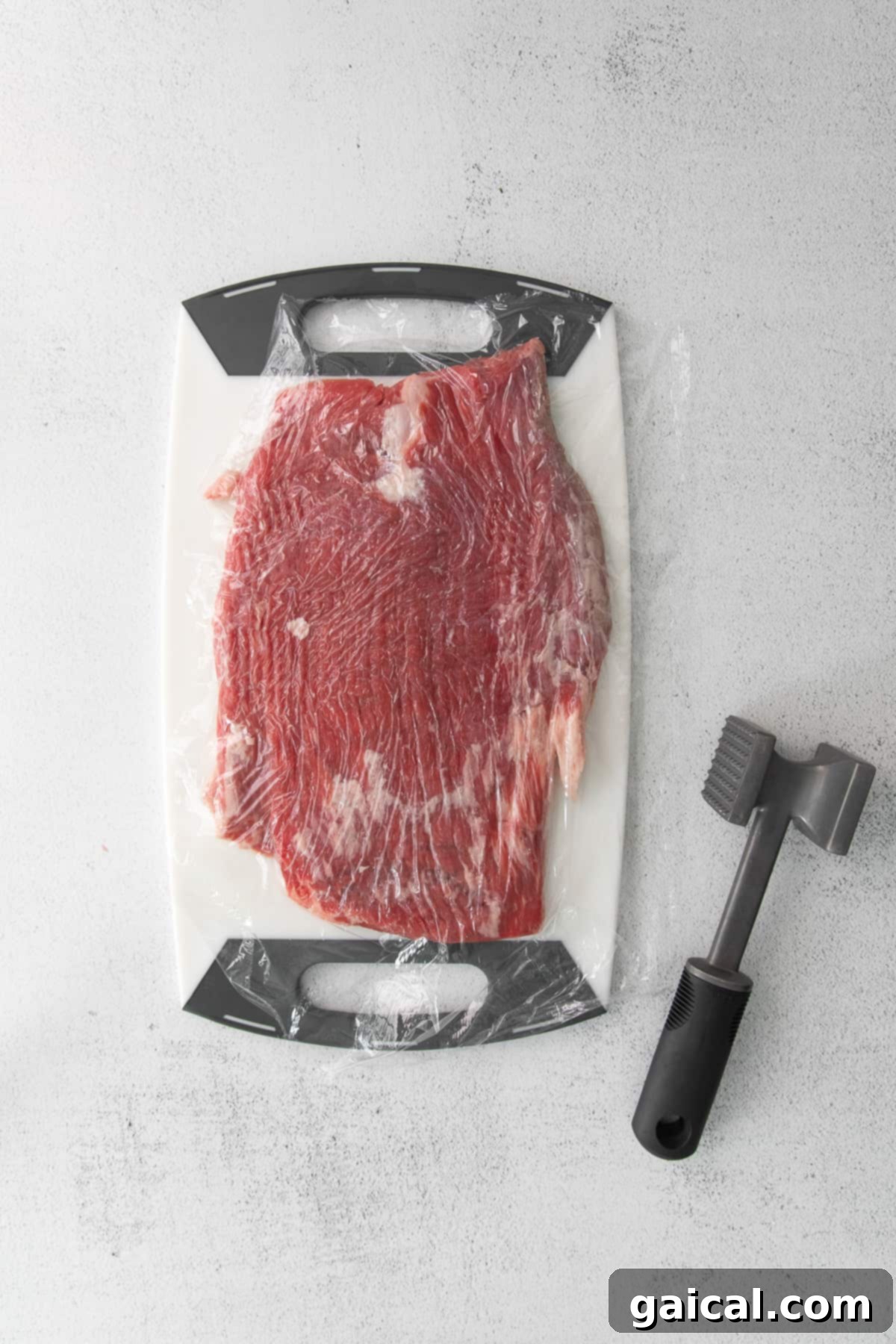 Sizzling Pepper Steak 5 Flank steak with a meat tenderizer.