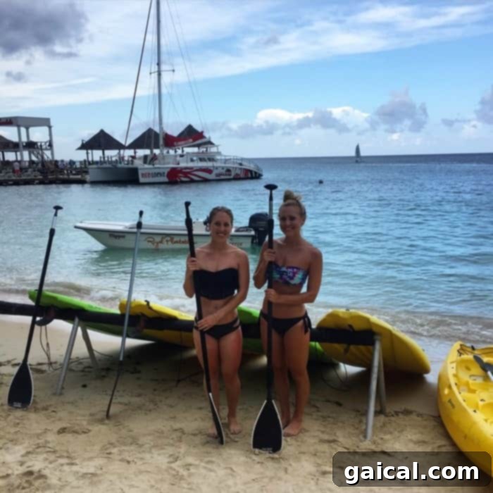 Enjoy serene Stand-Up Paddleboarding (SUP) at Sandals Ochi Beach Resort in Ocho Rios, Jamaica, part of your amazing Funjet Vacations itinerary with snorkeling, delicious food, and more.