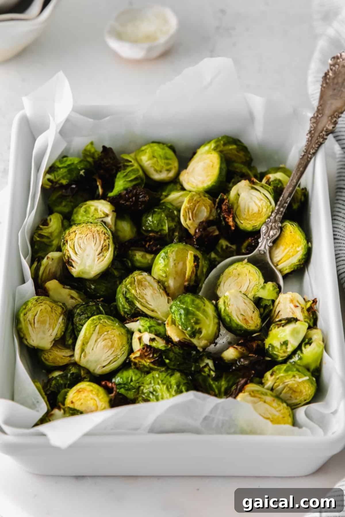Perfectly Crisp Air-Fried Brussels 6 Air fryer brussel sprouts in a casserole dish.