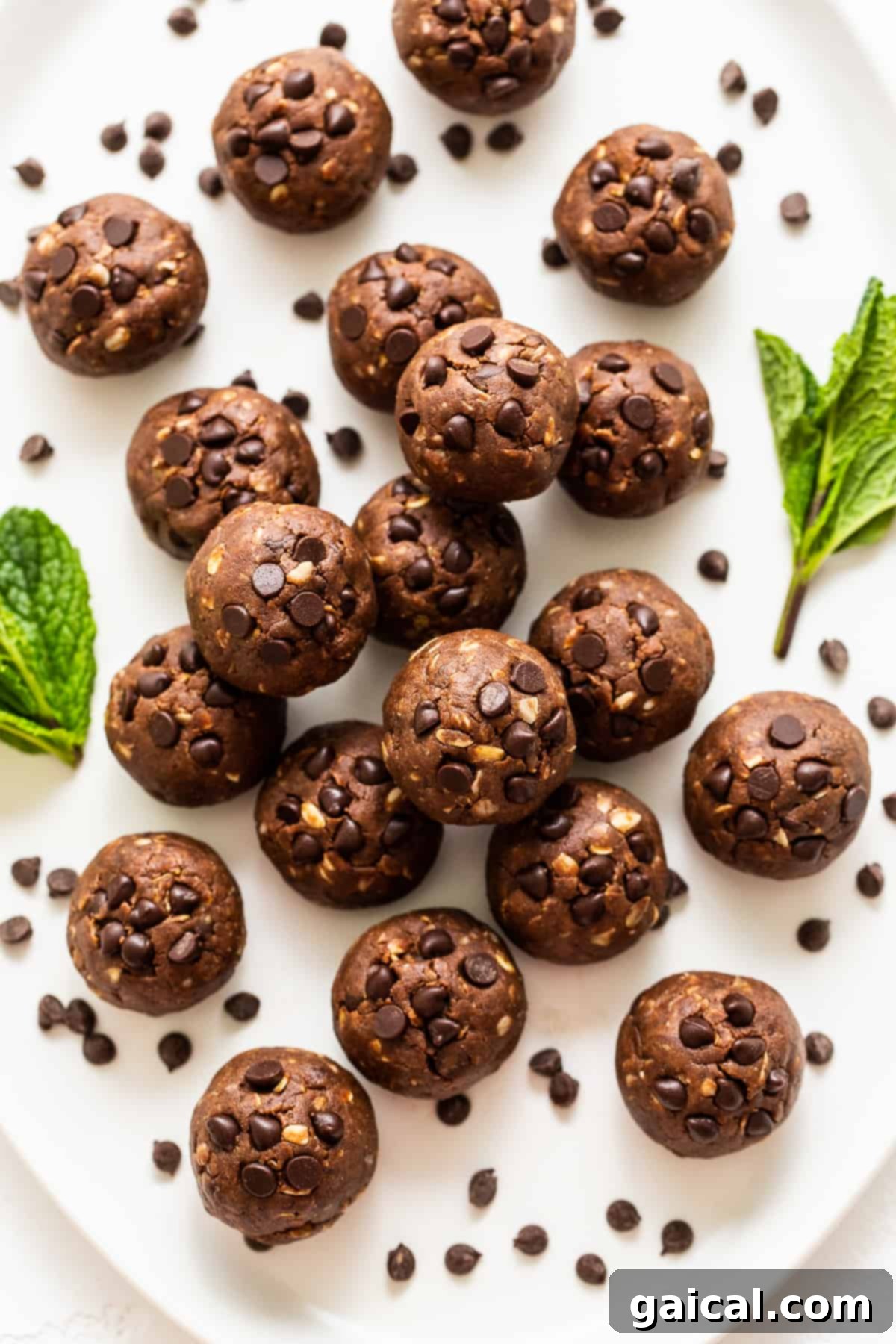 Enjoy Your Delicious Mint Chip Protein Balls Platter of vibrant green mint chip protein balls with visible chocolate chips, beautifully arranged and ready to be served.