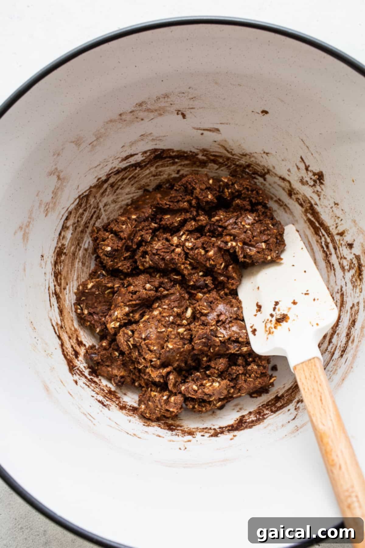 Achieving Perfect Protein Ball Dough Close-up of the mixed dough for mint chip protein balls in a glass bowl, showcasing its perfect, pliable consistency ready for rolling.