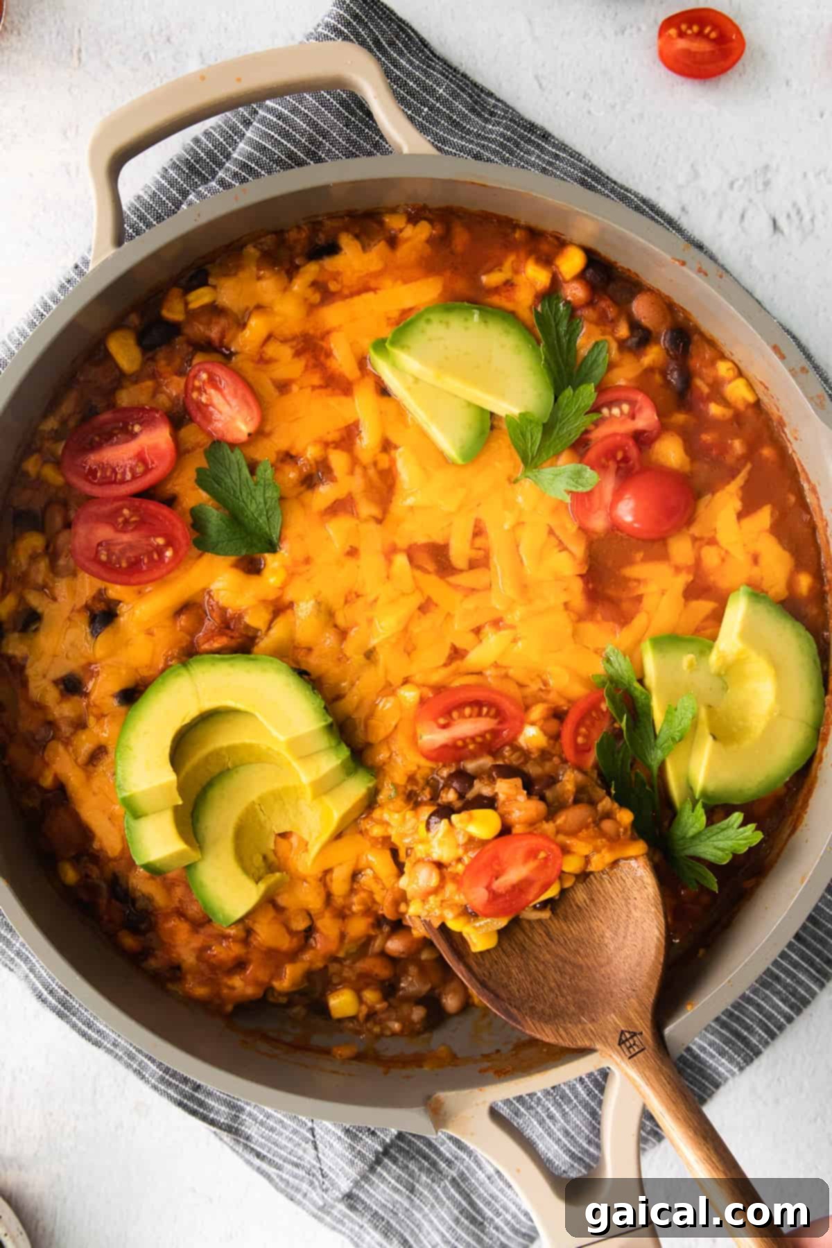 A beautifully garnished cauliflower taco skillet in a pan, ready to serve.