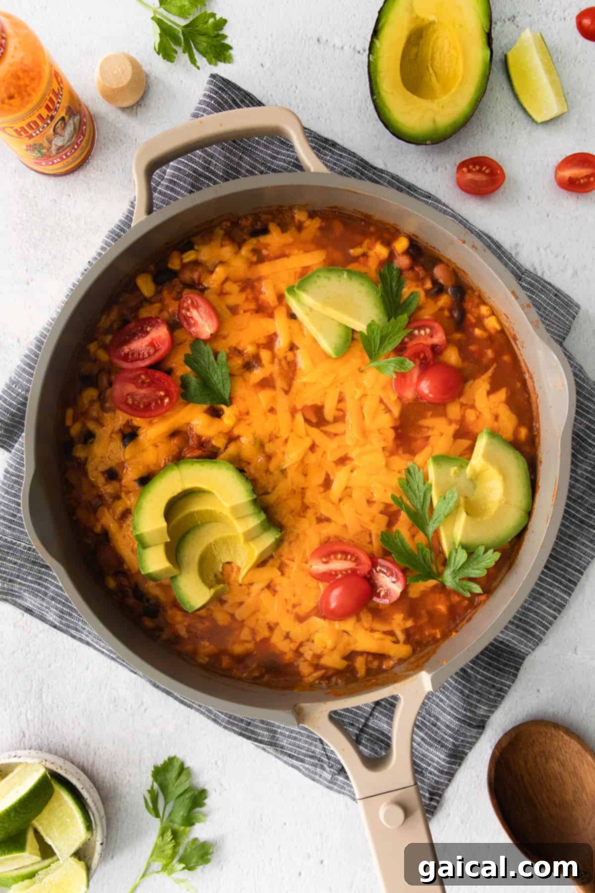 Full view of the cauliflower taco skillet in a pan with vibrant toppings.