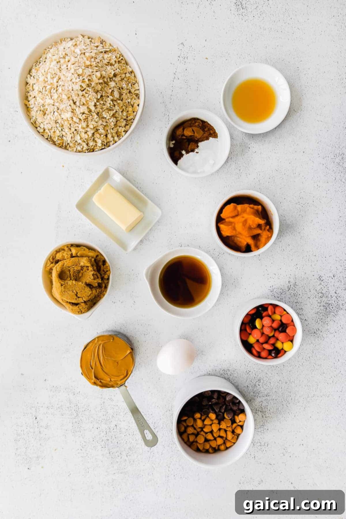 The most delicious fall cookies you've ever tasted - Pumpkin Monster Cookies made with pumpkin puree, butterscotch chips, and m&m's. monster cookies ingredients laid out for baking