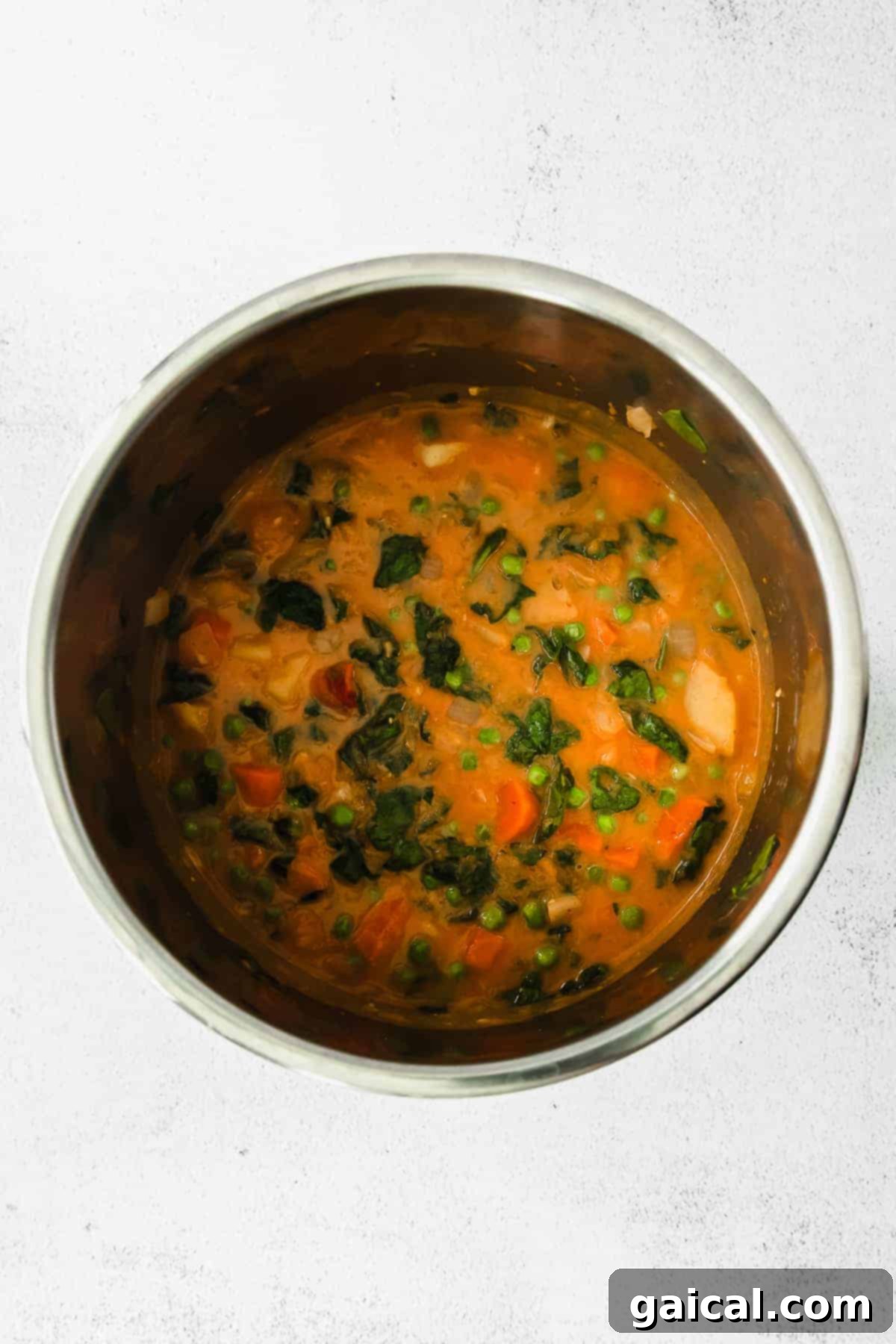 Flavorful Instant Pot Pumpkin Curry 6 Vegetarian Instant Pot pumpkin curry bubbling in the pot, showcasing its rich texture and colorful vegetables, ready to be served.