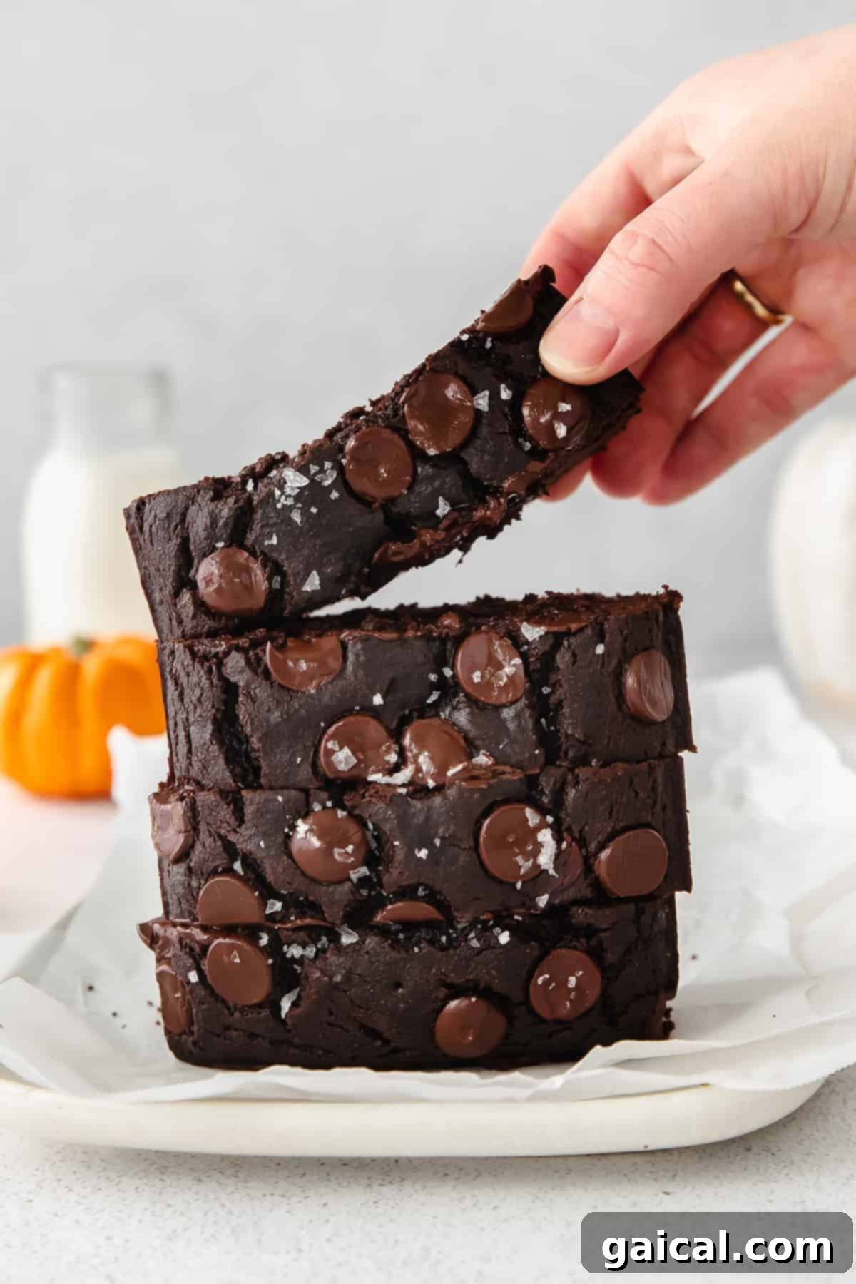 A tempting stack of freshly baked chocolate pumpkin bread slices, ready to be devoured.