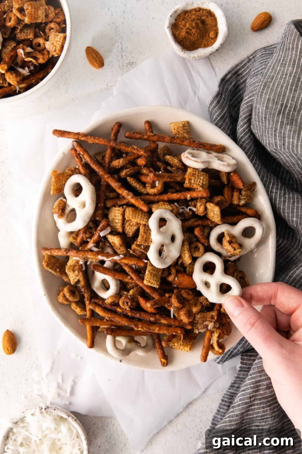 Maple Chai Chex Crunch 11 A vibrant and enticing close-up of a bowl overflowing with freshly made Chai Chex Mix, highlighting its irresistible sweet and salty appeal.