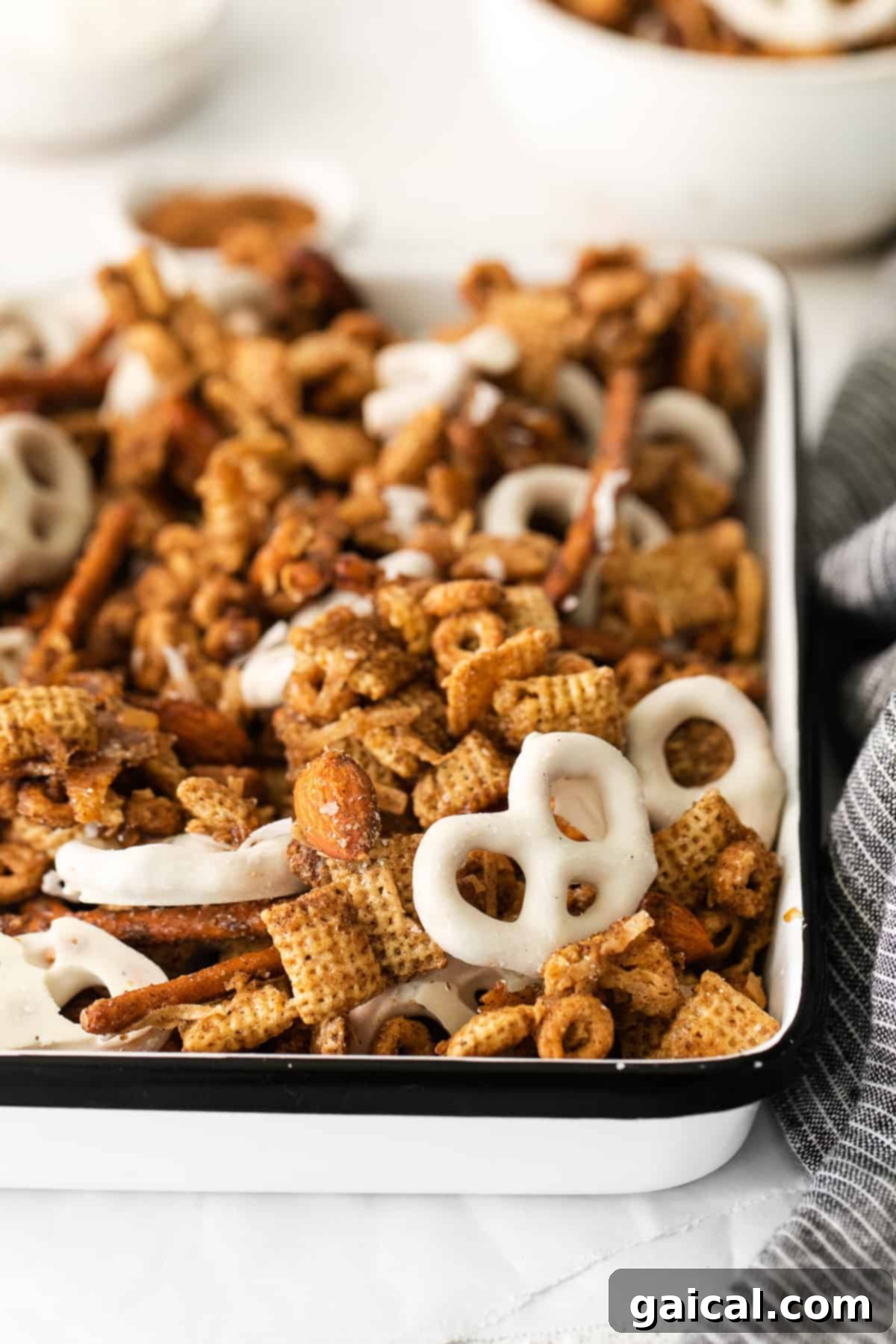 Maple Chai Chex Crunch 8 A charming close-up of Chai Chex Mix, beautifully arranged in a rustic bowl, highlighting its texture and inviting appearance.