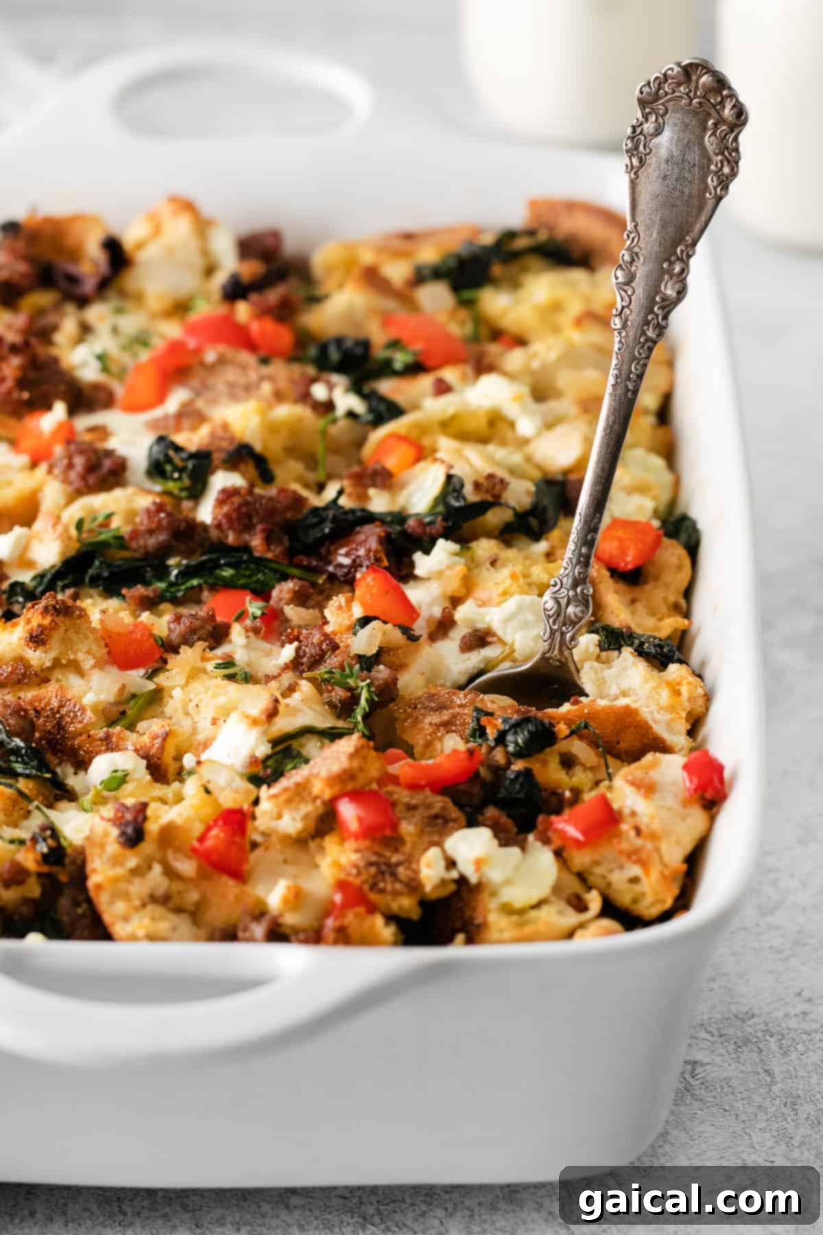 Hearty English Muffin Breakfast Casserole 4 A close-up view of the English muffin breakfast bake in a casserole dish, highlighting its golden-brown top and savory ingredients.