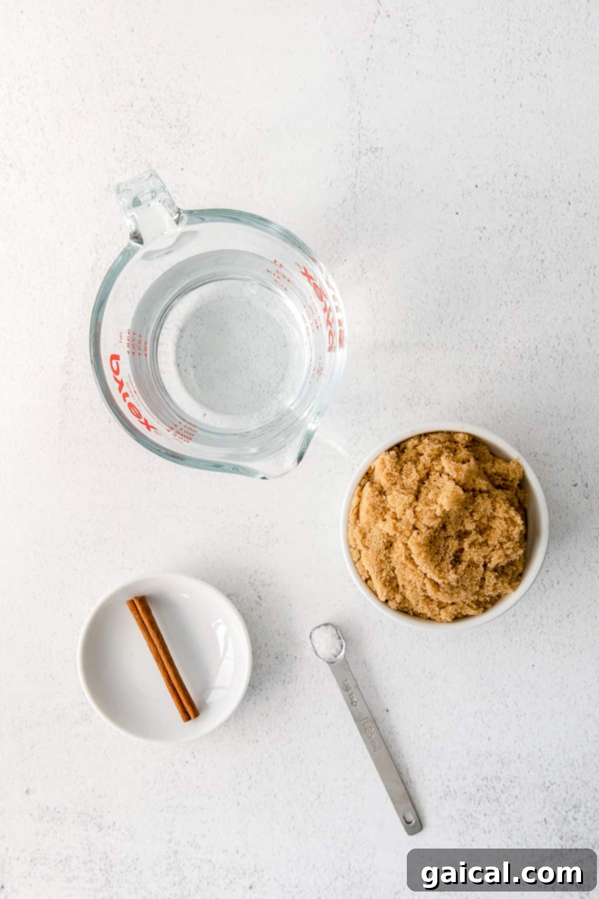 Close-up of brown sugar and water in a saucepan, ready to be transformed into simple syrup.
