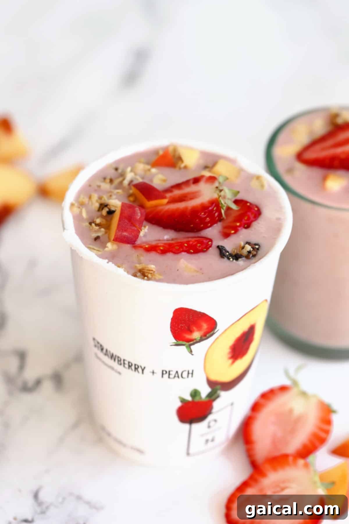 We've been longtime fans of Daily Harvest and their smoothies, so we're thrilled to share our full and honest reviews of ALL of the food in their collections. daily harvest smoothie in a cup topped with fresh berries