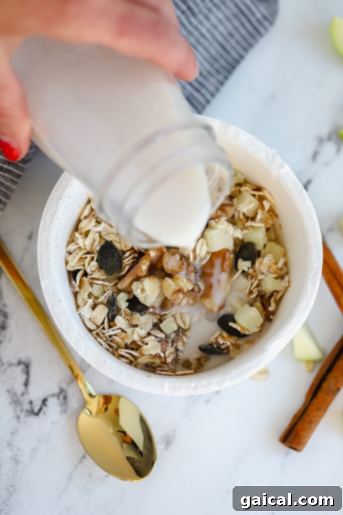 We've been longtime fans of Daily Harvest and their smoothies, so we're thrilled to share our full and honest reviews of ALL of the food in their collections. milk being poured over an oat bowl