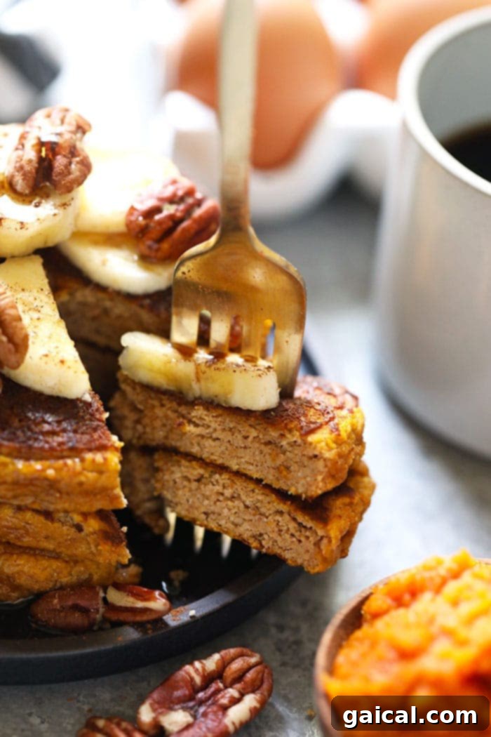A vibrant, full-page photograph showcasing a beautifully presented stack of golden-brown gluten-free pumpkin pancakes. Each pancake is perfectly cooked, adorned with a generous drizzle of maple syrup, a sprinkle of pecans, and a delicate dusting of powdered sugar, all inviting a delightful autumn breakfast experience.