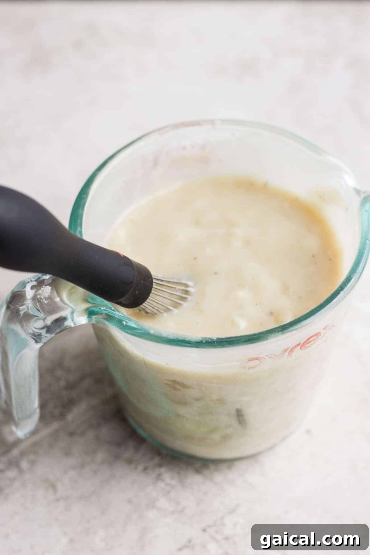 Soul-Warming Slow Cooker Chicken and Dumplings 5 A thick, creamy roux (flour-broth slurry) being prepared to thicken the slow cooker chicken and dumplings.