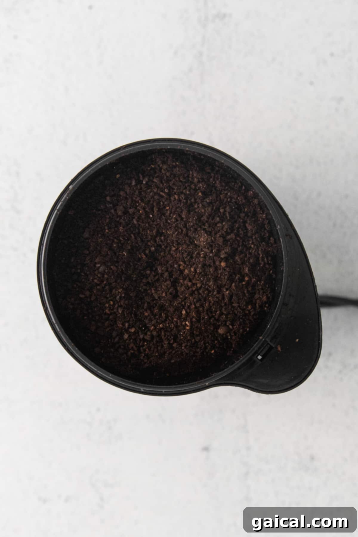 Pour over coffee is hands down the best kind of morning jo. Learn how to use your Chemex in this pour over coffee recipe tutorial. coffee grounds in coffee grinder