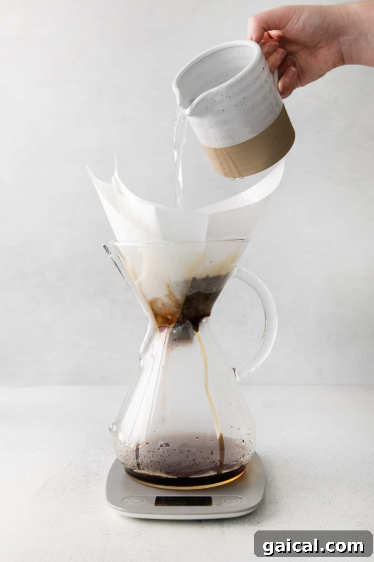Pour over coffee is hands down the best kind of morning jo. Learn how to use your Chemex in this pour over coffee recipe tutorial. pouring water into chemex